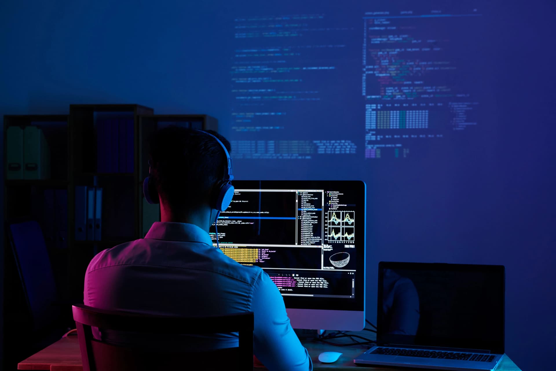 Team member working at a coding workstation